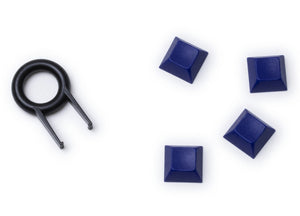 4 Keyzen keycaps in galaxy purple color with the puller
