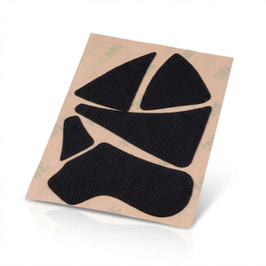 Black adhesive patches on a beige backing with a white background