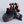 Black and red Cyborg device on a light gray background